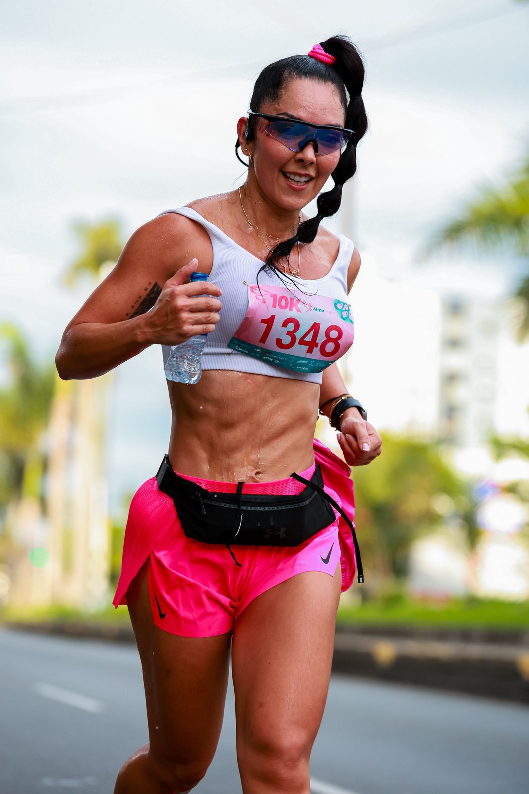 A race participant wears a close-fitting black running belt.